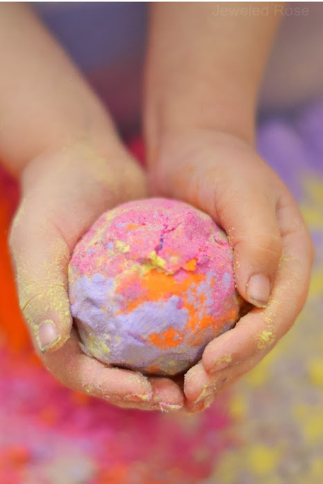 Make cloud dough in every color of the rainbow with this easy recipe for kids! #clouddough #clouddoughrecipe #coloredclouddough #rainbowclouddough #growingajeweledrose #activitiesforkids