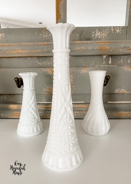 three milk glass bud vases display