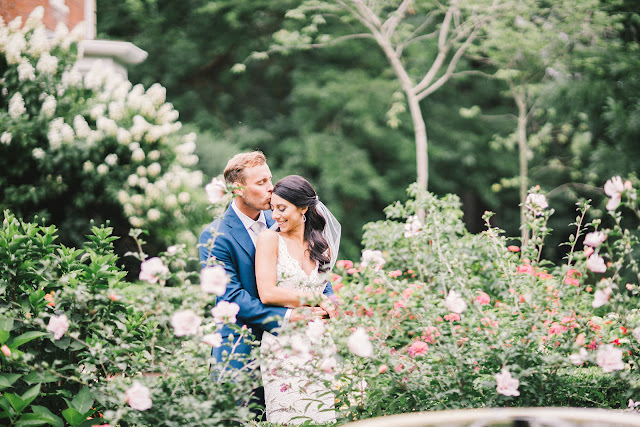 Niagara Wedding Planner | A Divine Affair | Sara and Daniel - Photo by Julia Park Photography. Ceremony and Reception at Kurtz Orchards Gracewood Estates. Ceremony under a chiffon and floral draped tree. Reception in a tent with live edge wooden harvest tables. 