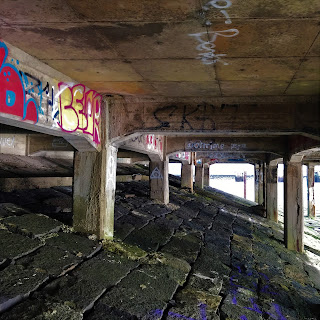 Concrete support pillars underneath the abandoned, derelict lighthouse at Leith Docks, Edinburgh.  Photo by Kevin Nosferatu for the Skulferatu Project