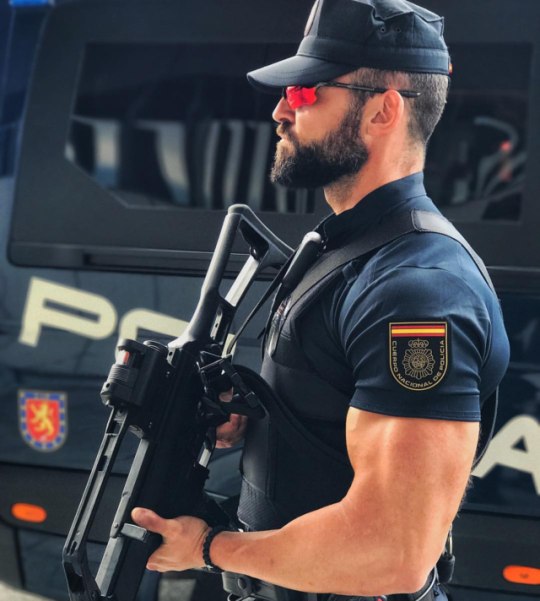strong-bearded-uniformed-policeman-big-biceps-gun-sunglasses