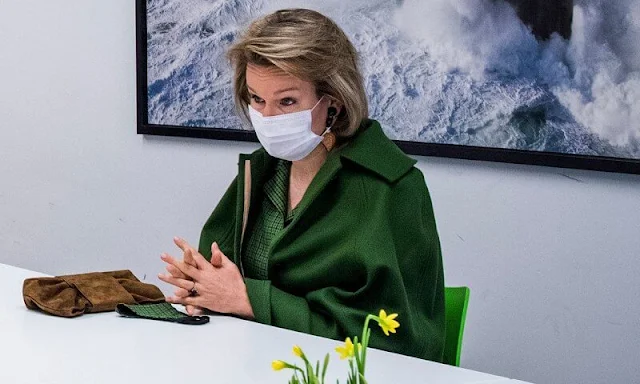 Queen Mathilde wore a green wool canvas and cashmere cape and green dress from Natan