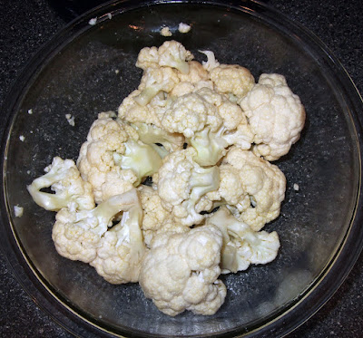 Cauliflower coated in oil or butter.