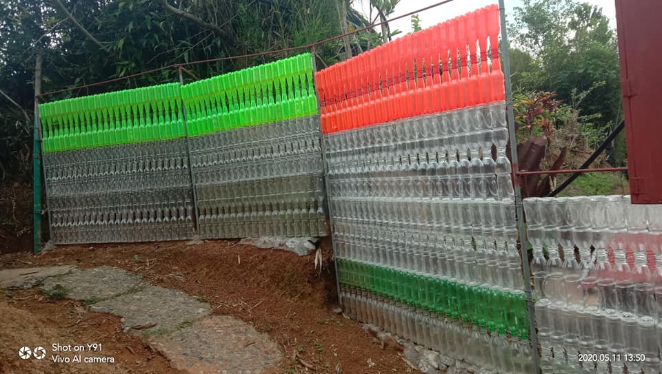 A family in Kapangan builds beautiful fence using hundreds of recycled