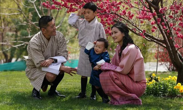 King Jigme Khesar Namgyel Wangchuck, Queen Jetsun Pema, Gyalsey Jigme Namgyel and Gyalsey Ugyen. Satin dress