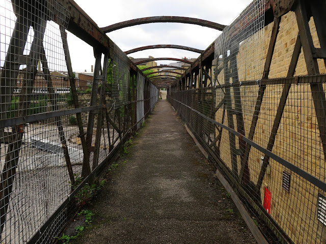 Footbridge in Halifax, West Yorkshire. Looks as if it used to be covered but no longer is.