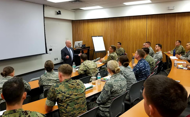 USU President Dr. Richard Thomas welcomes a new class of EMDP2 students to the University.  (Uniformed Services University photo)
