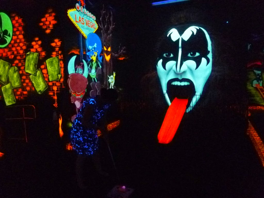 Emily playing 'The Demon' hole at KISS Monster Mini Golf course in Las Vegas KISS Monster Mini Golf course in Las Vegas