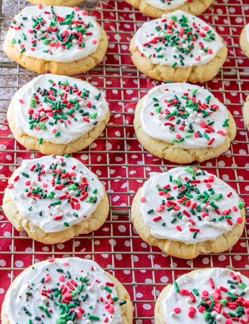 The Best Vanilla Almond Frosted Sugar Cookies holiday on a wire rack