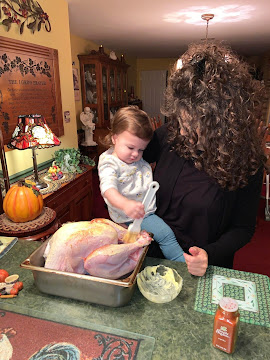 Naminé with her Gigi (my sister, Laura) buttering the Thanksgiving Turkey - Nov. 2021