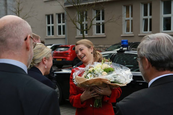 Grand Duchess Stephanie visited Belval Campus in Luxembourg University. Princess Stephanie style Prada clutch bag, wore Prada red jacket