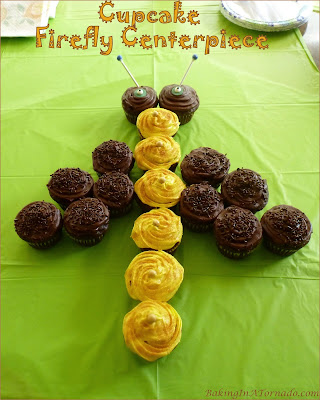 A Cupcake Firefly Centerpiece is perfect for summer parties or cookouts. Cupcakes are decorated and assembled for a fun edible centerpiece. | Recipe developed by www.BakingInATornado.com | #recipe #summer
