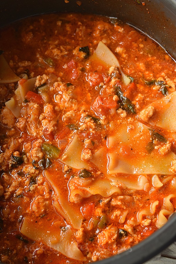 a black casserole with one pot lasagna soup