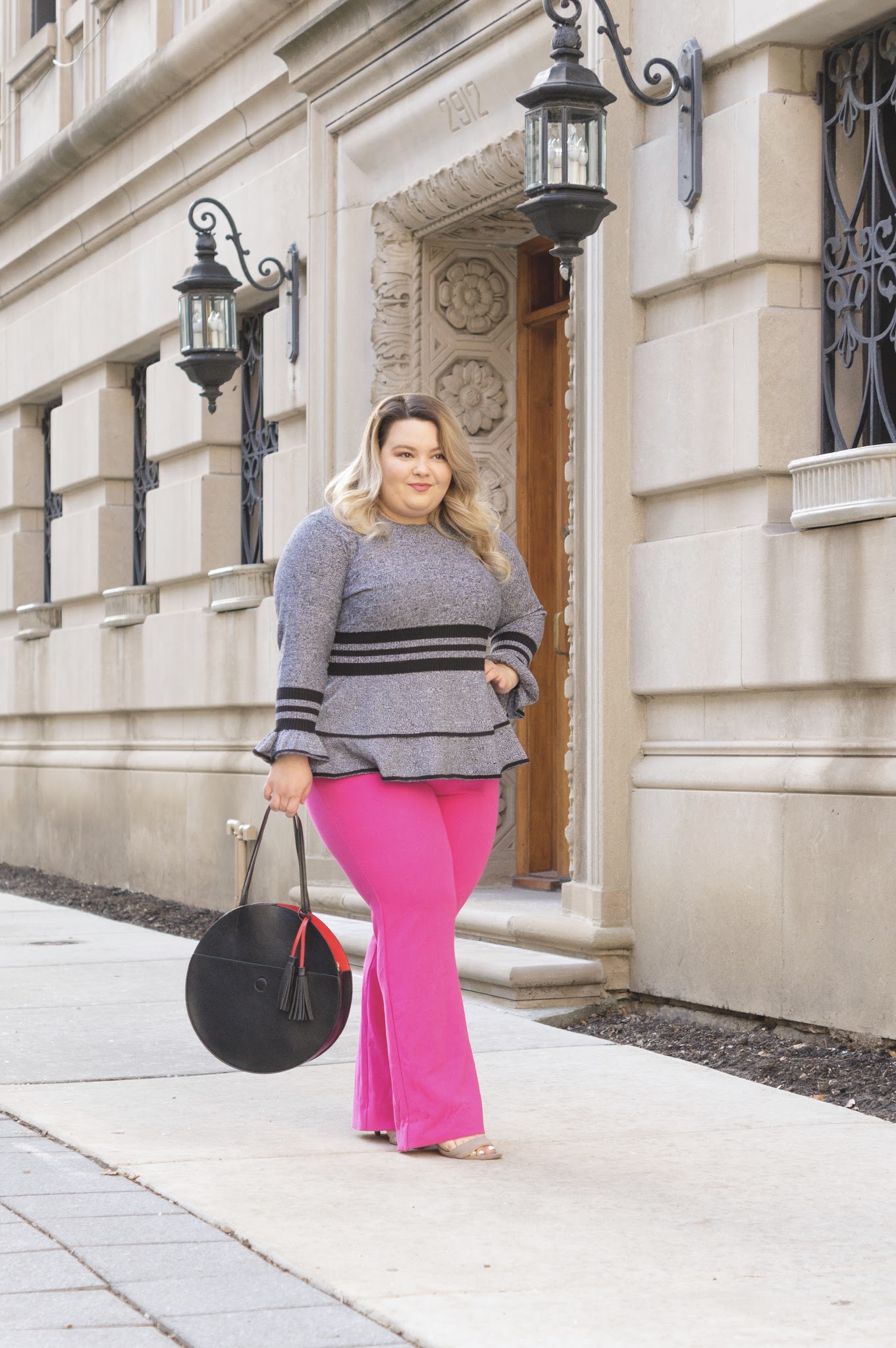 Chicago Plus Size Fashion Blogger Natalie in the City reviews Eloquii's sweaters and the Victoria Beckham for Target Fuscia Twill Flared Trousers.