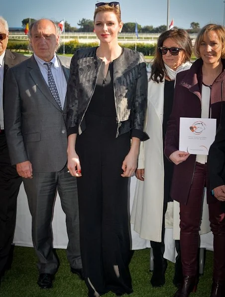 Princess Charlene wearing an Akris Ilka Jockey Jacquard Short Jacket and Akris Silk Crepe Jumpsuit 