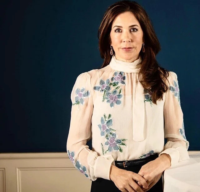 Crown Princess Mary wore a light blue floral embroidered chiffon pussy-bow blouse from Prada