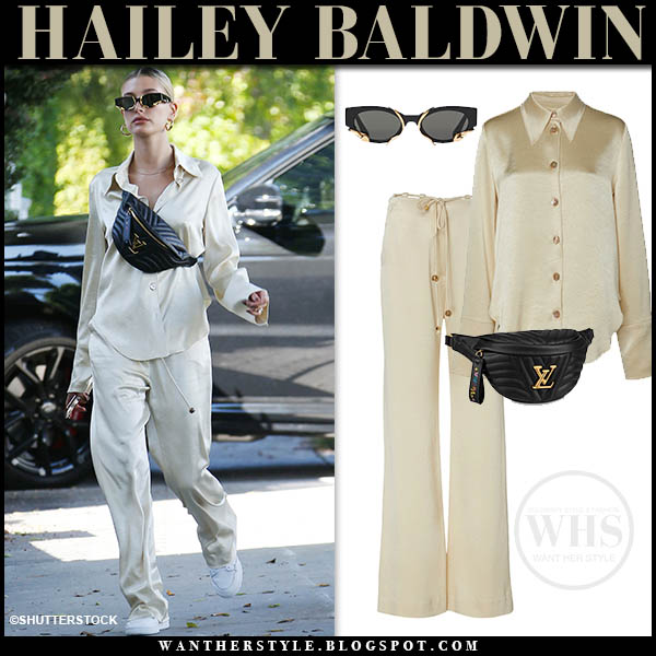 Hailey Baldwin in beige satin blouse and satin pants in West