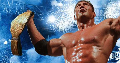 WWE superstar Batista holding the World Heavyweight championship belt