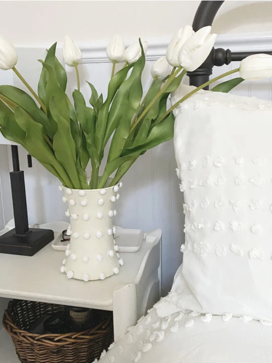 Matching chenille vase next to chenille bed set