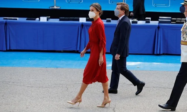 Queen Letizia of Spain wore a red long sleeve flared midi dress by Salvatore Ferragamo