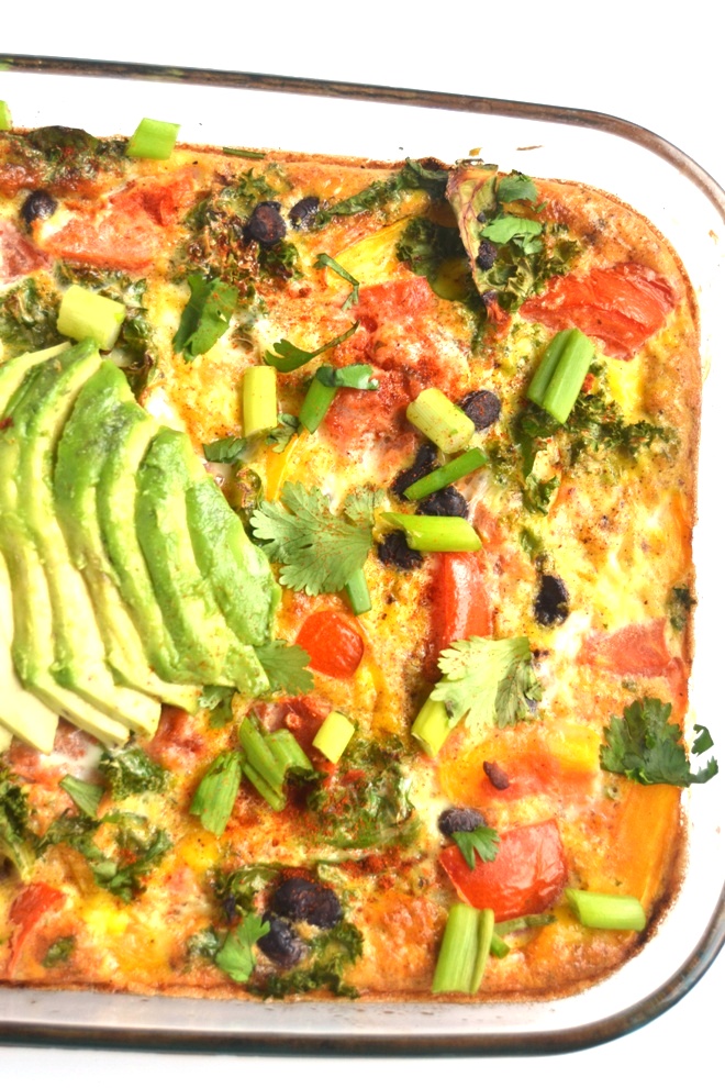 This Mexican Breakfast Casserole is simple to make and is full of flavor with black beans, salsa, bell peppers, avocado and cilantro! www.nutritionistreviews.com
