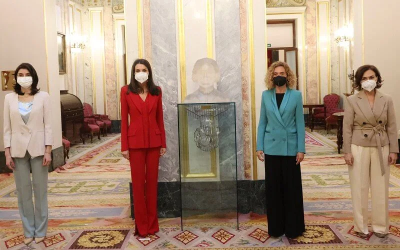 Queen Letizia wore a two-piece red suit by Spanish fashion designer Roberto Torretta