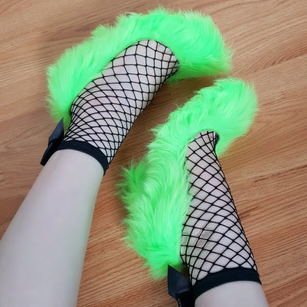 Dolce & Gabbana fluffy green shoes on feet