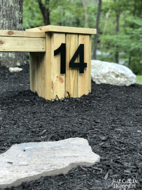 Outdoor bench and planters with house numbers