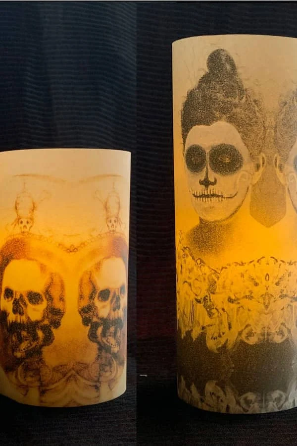 two vellum Halloween luminaries feature scary images