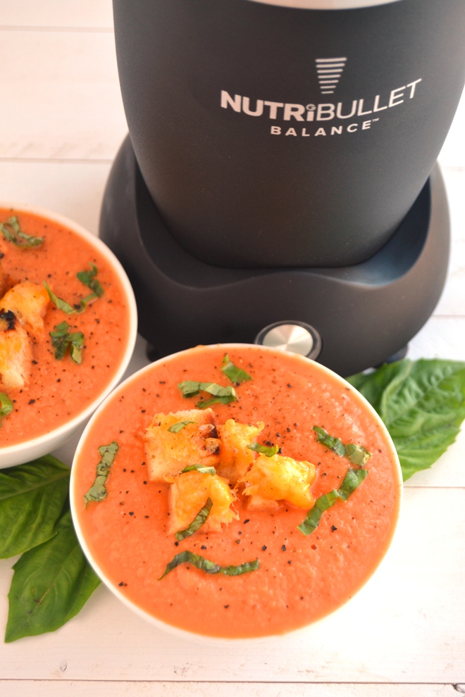 Roasted Tomato Soup is just 5 ingredients, creamy despite having no dairy and is loaded with flavorful roasted tomatoes, onions, garlic, basil and grilled cheese croutons! www.nutritionistreviews.com