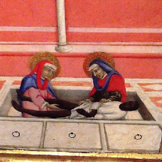 Sano di Pietro particolare della predella della Madonna col Bambino: i santi Cosma e Damiano tagliano la gamba ad un etiope morto.