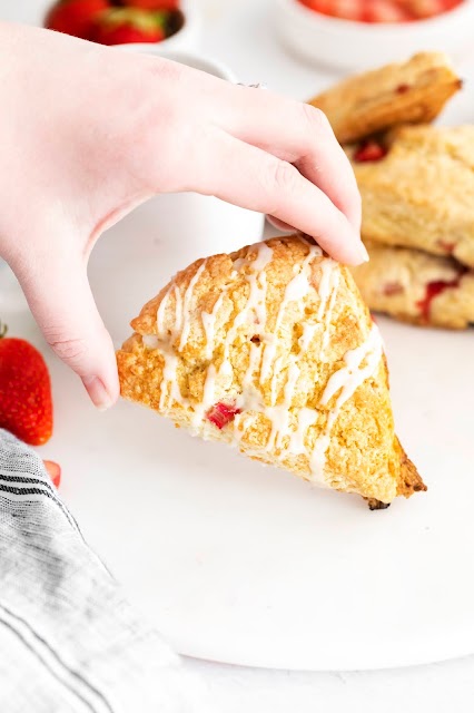 Hand holding a scone