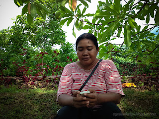 Woman Traveler With Her Smartphone In The Sweet Garden North Bali Indonesia