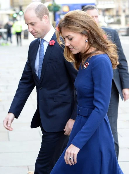 Kate Middleton wore Emilia Wickstead Kate a-line wool crepe dress in navy blue. Poppy Collection the first world war diamond brooch