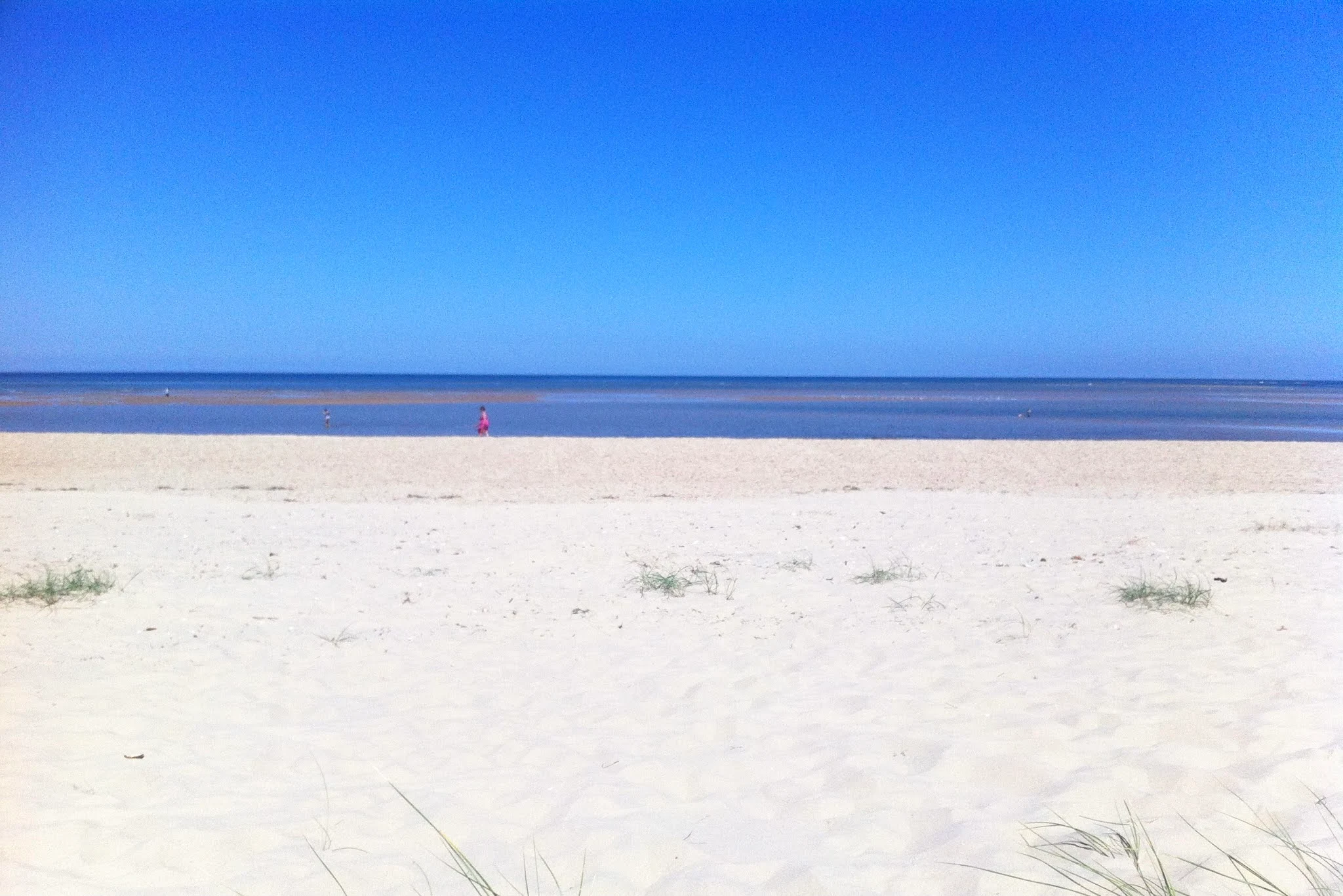 A sandy beach in North Norfolk and blue skies