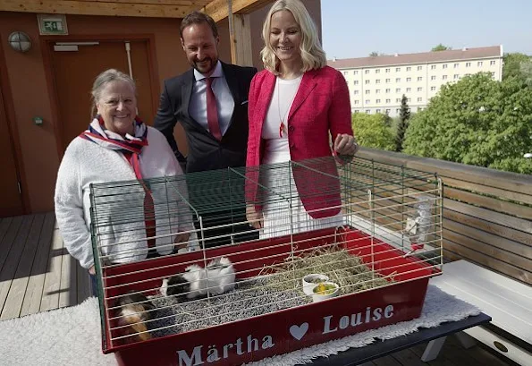 Crown Princess Mette-Marit wore a new Altuzarra skirt with her Prada red jacket and Yvonne Koné suede pumps. The Crown Couple visited Sagene Church