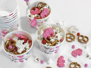 Quick and easy snack made with pretzels, popcorn, animal cookies and chocolate. No Mess.