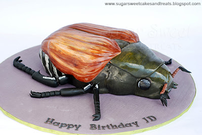 Realistic looking Japanese Beetle Cake on a 16 inch cake board