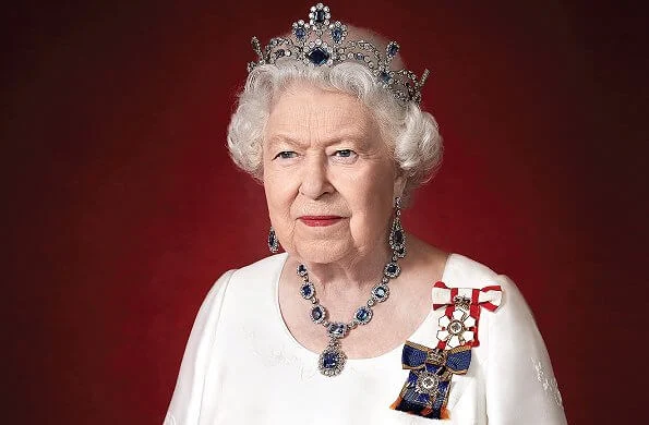 Queen Elizabeth is wearing Sovereign of the Order of Canada and the Order of Military Merit and Modern Sapphire Tiara and George VI Sapphire parure