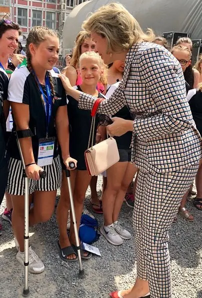 Queen Mathilde visited the Eurogym 2018 International Gymnastics FestivalShe wore Natan pantsuit Natan Collection, Armani clutch