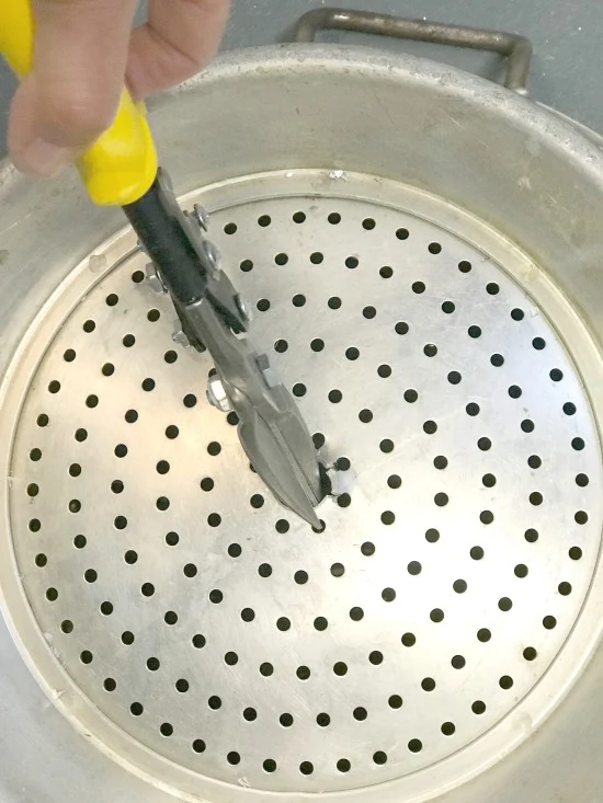 Cutting a hole with tin snips