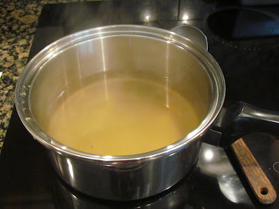 chicken stock in a saucepan.