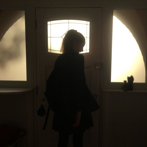 teen silhouette by front door