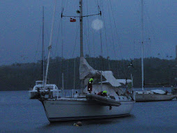 neighbouring boat emptying dinghy during storm