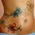 Colorful lily flower tattoo on front chest 