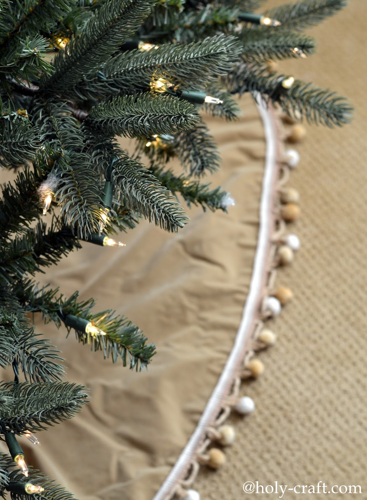 Vintage tablecloth turned into Christmas tree skirt