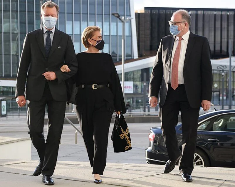 Grand Duchess Maria Teresa wore a black blouse and black trousers, and embroidered black bag