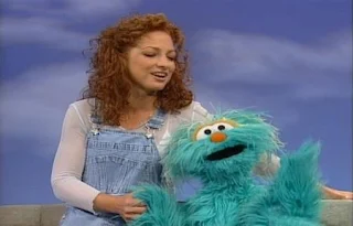 The song Sing, Sing A Song performed by Gloria Estefan and Rosita. Sesame Street Best of Friends