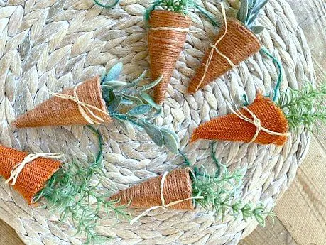 Jute and burlap carrots laying on placemat