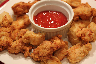 chicken nuggets with a side of ketchup